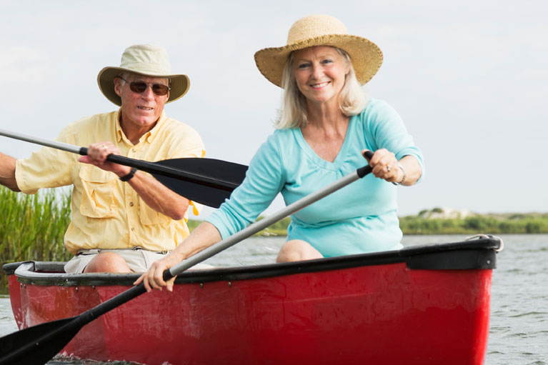 Elderly couple canoeing